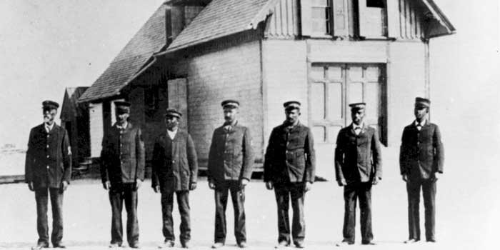 Richard Etheridge and the crew of the Pea Island Life-Saving Station standing in front of the station