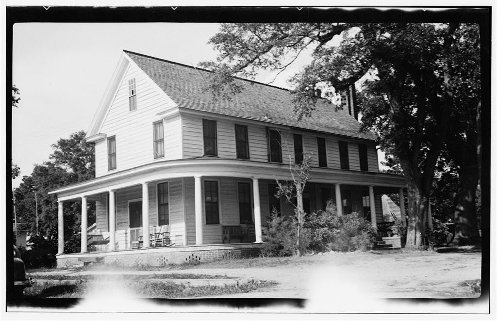 Two-story white frame Palmer-Marsh House in Bath with a long front porch and a large tree