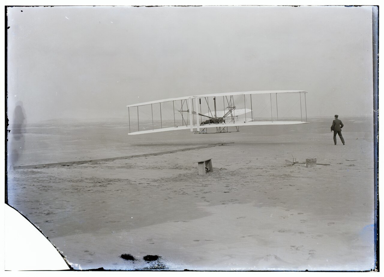 First powered flight at Kill Devil Hills, December 17, 1903: the Wright Flyer a few feet off the ground